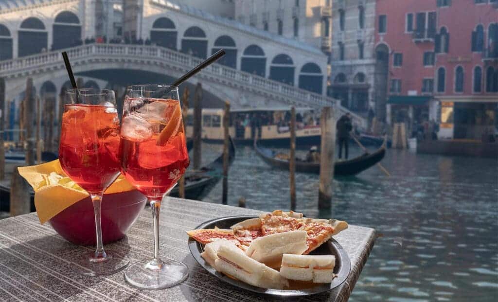 a spritz glasses served with the snacks along with the view of vince city