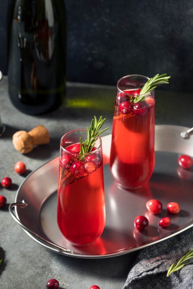 Boozy Holiday Cranberry Champagne Poinsettia Cocktail With Rosemary