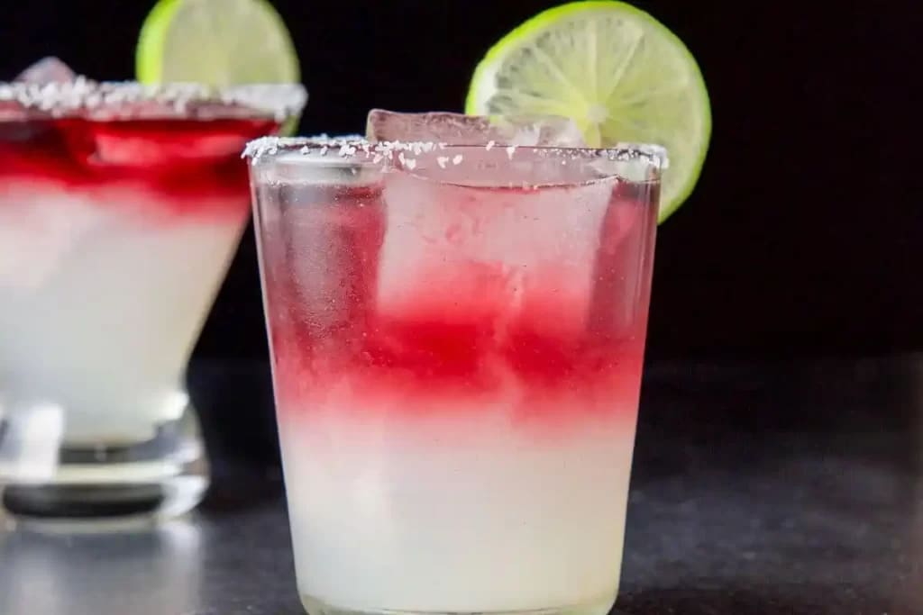 chilled glasses of Margarita Sangria served with lime wedge