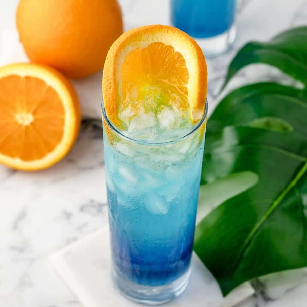 mocktail blue lagoon served with orange slice