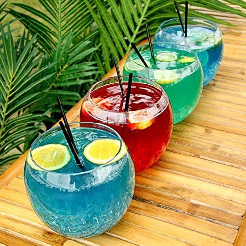 splash cocktails in fish bowl top with lemon wedges