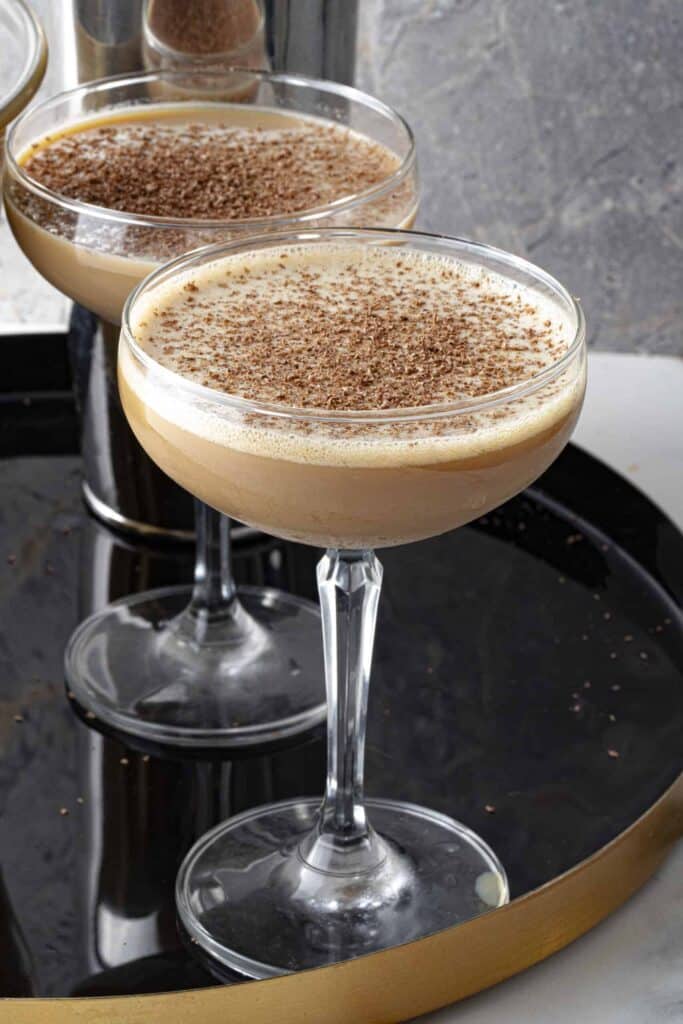 Espresso Martini With Vanilla Vodka served in glasses with coco powder sprinkled on top