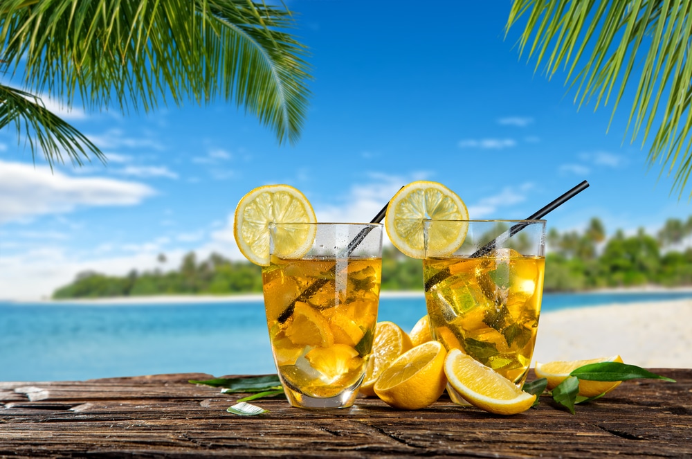 Glasses Of Summer Ice Tea Drink On Beach