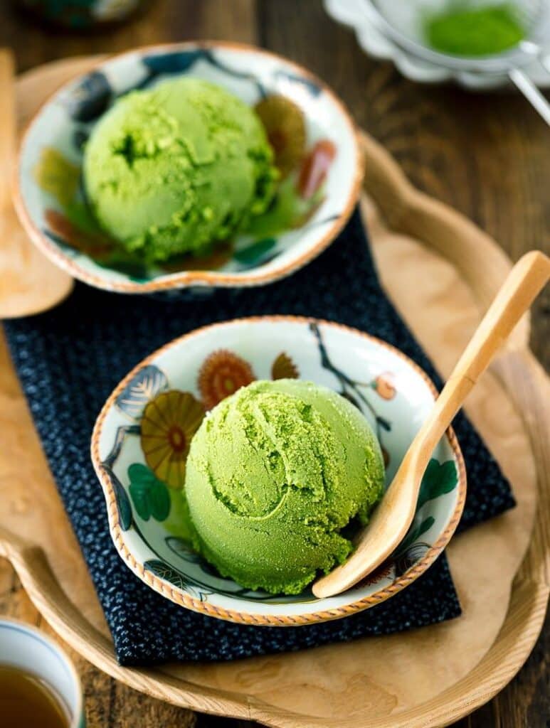 Green Tea Ice Cream served in a bowl with a spoon