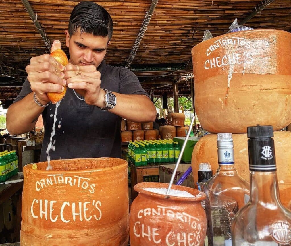 a man preparing big cantarito drink