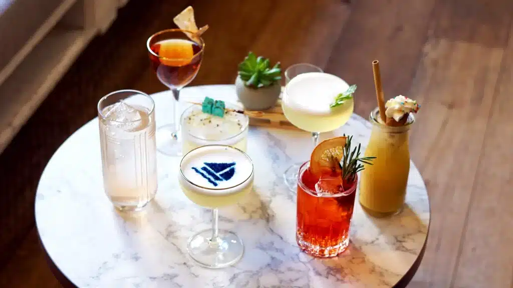 different types of french cocktails placed on a marble tray