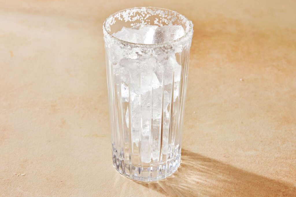 glass prepared with salt and ice for chilto cocktail