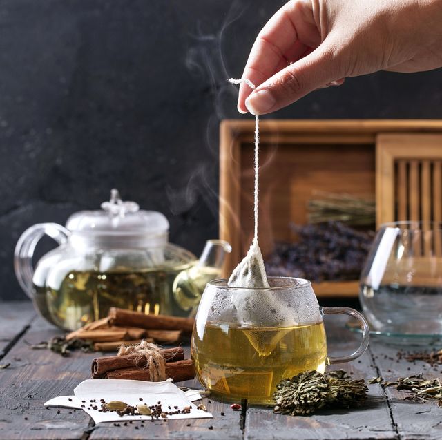 green tea in a kettle and cup