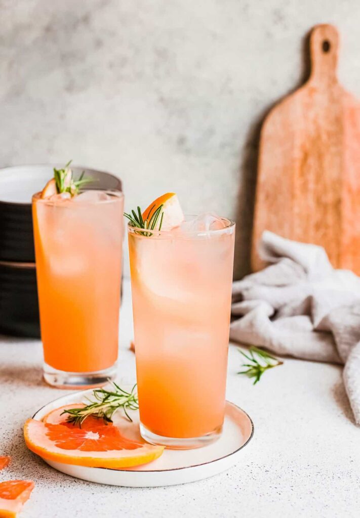 two glass of Grapefruit Tequila and Tonic placed in a mini tray garnished with grapefruit slice