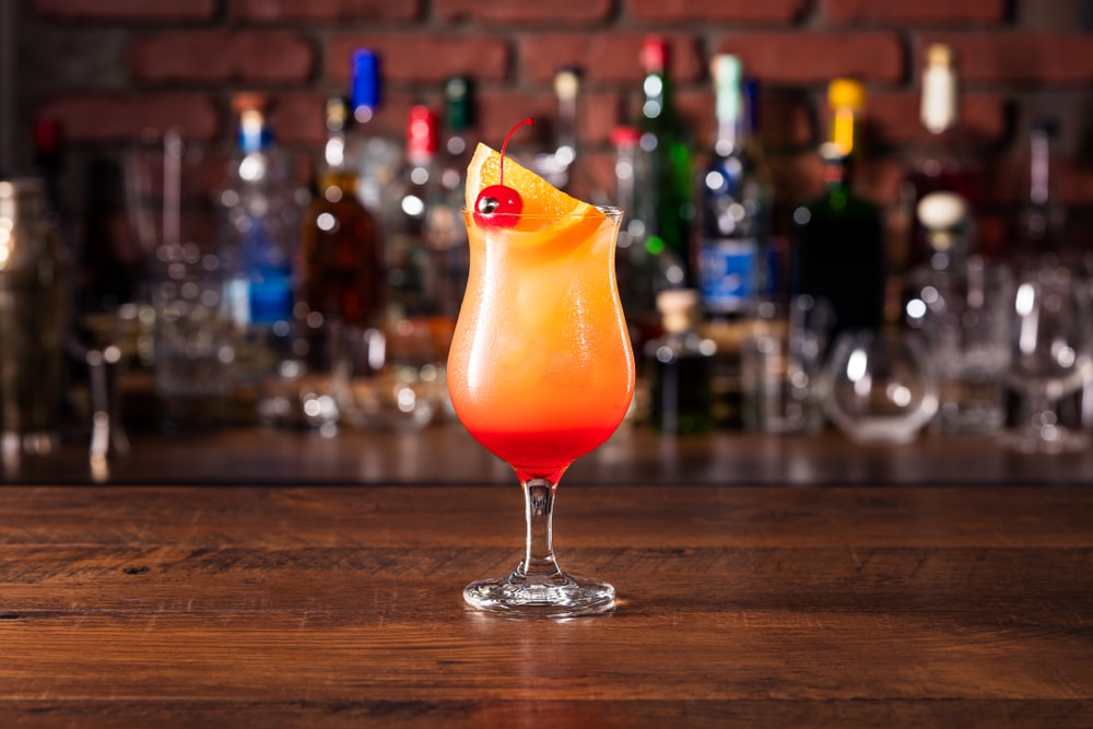 A view of a glass of a tropical hurricane cocktail