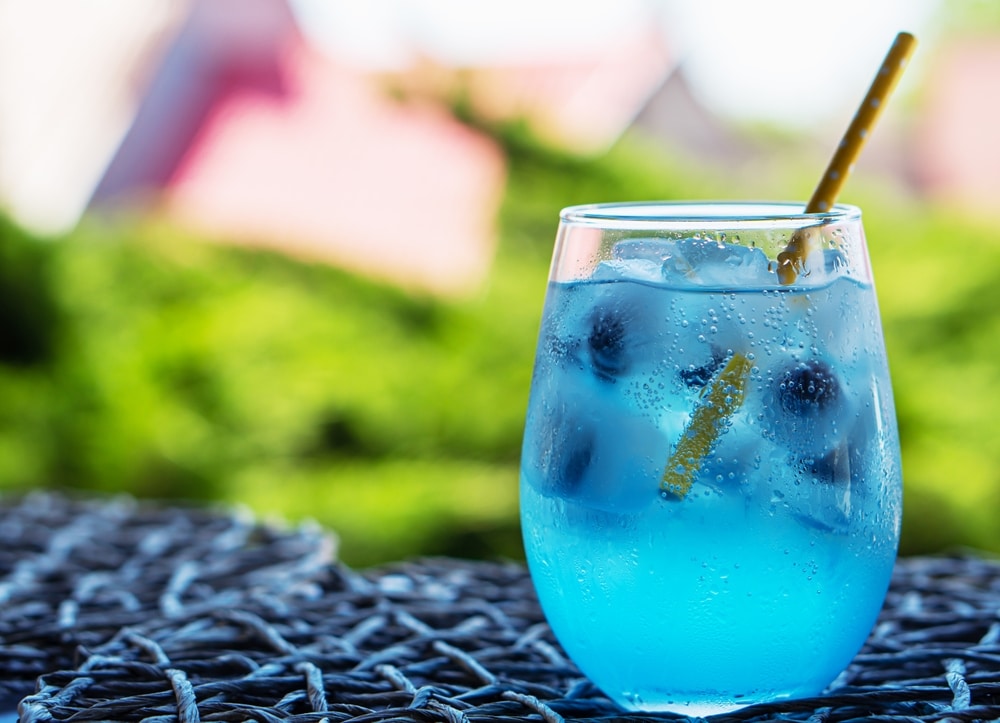 A view of a glass of cold blueberry drink