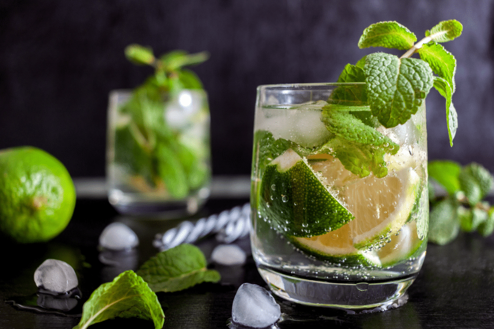 A view of a glass of sprite with lemon and rum