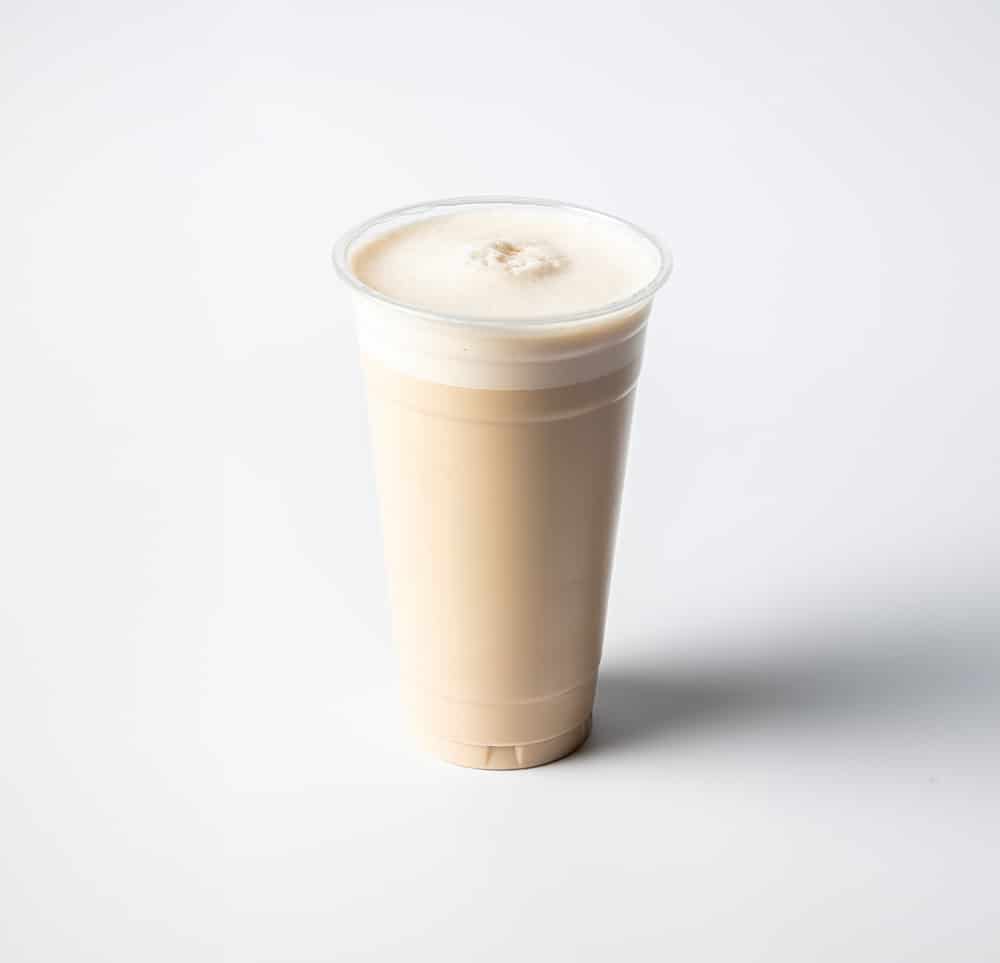 A large glass of white chocolate chai latte