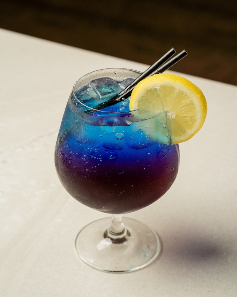 A glass of a blue lemonade