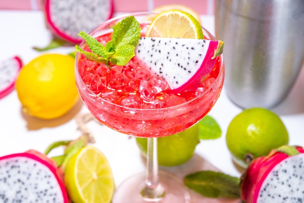 A view of a cocktail glass of dragon fruit drink