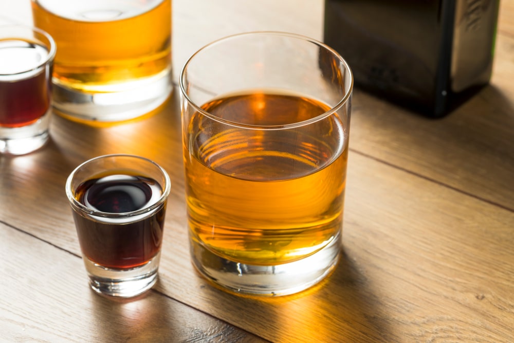 A view of a glass and shot of vegas bomb drink